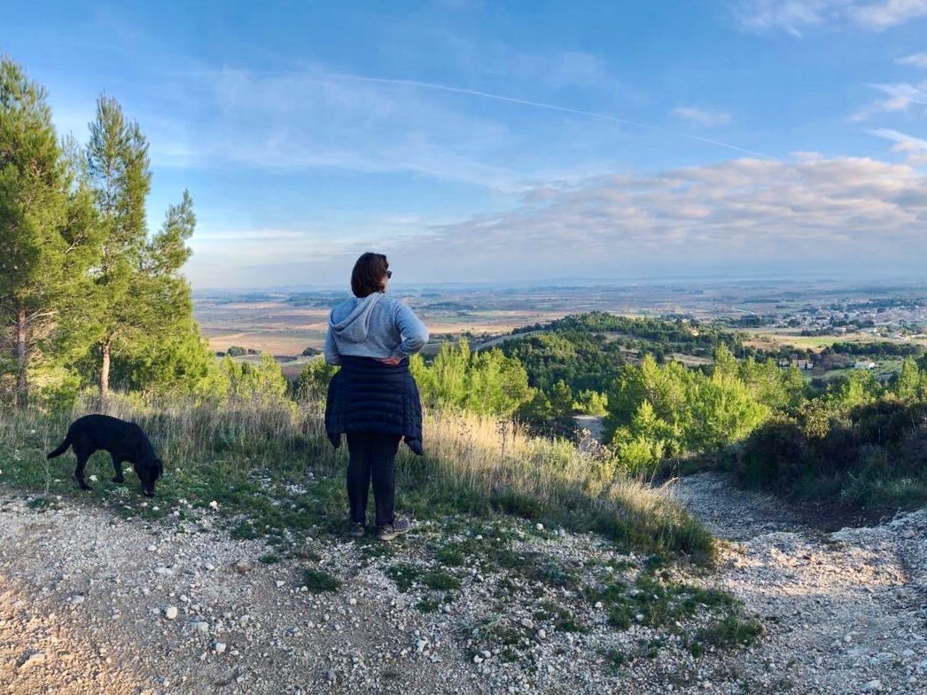 Guests walking their dog through the Minervois countryside